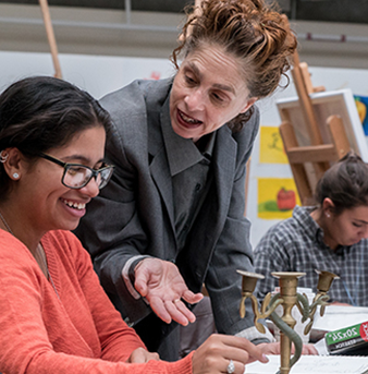 Teacher helping students in class